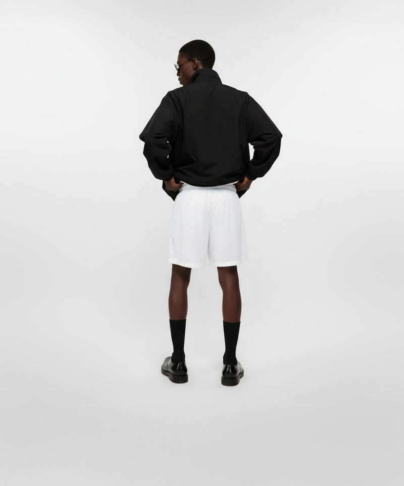 BECCA Q unisex mesh shorts, lifestyle shot